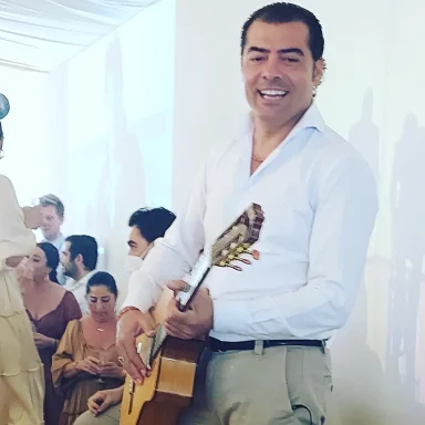 Guitar at the Feria Man playing the Spanish guitar
